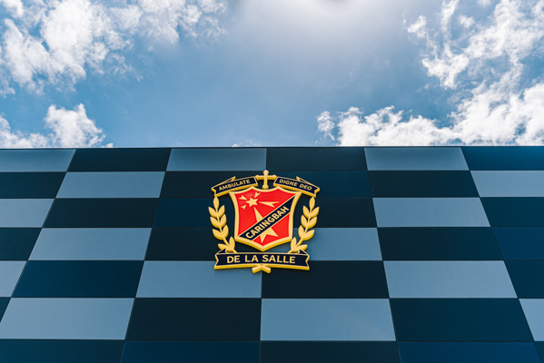 De La Salle Catholic College Caringbah school's emblem on school wall